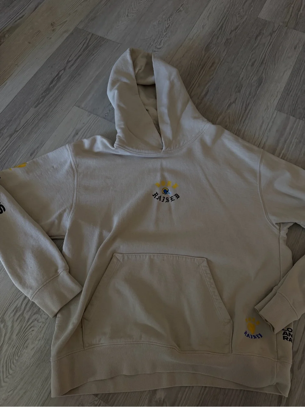 BORN X RAISED Cream Hoodie with Yellow & Blue Logo